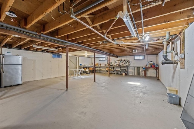 basement with freestanding refrigerator