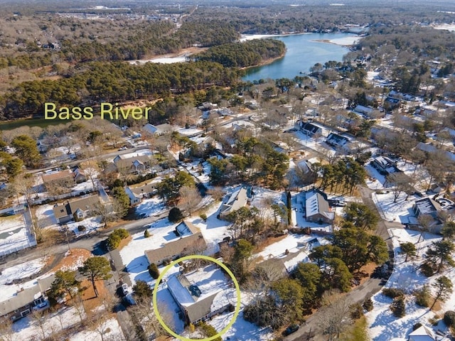 aerial view featuring a residential view, a forest view, and a water view