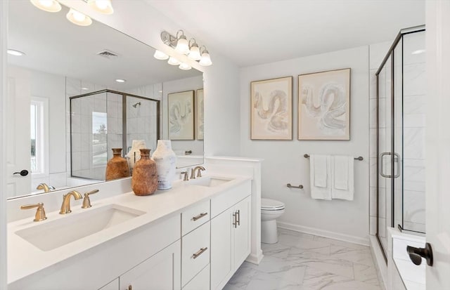 bathroom with vanity, an enclosed shower, and toilet