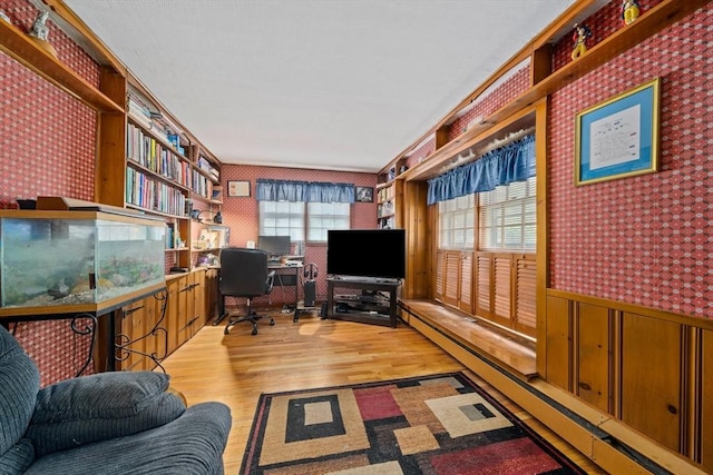 70 Bestick Rd, Braintree, MA 02184 - office area featuring baseboard heating, light wood finished floors, wainscoting, and wallpapered walls