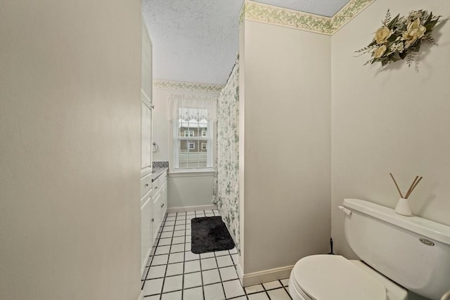 70 Bestick Rd, Braintree, MA 02184 - bathroom with toilet, tile patterned flooring, a textured ceiling, baseboards, and vanity