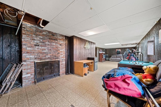 70 Bestick Rd, Braintree, MA 02184 - finished below grade area with a fireplace, wooden walls, and a paneled ceiling