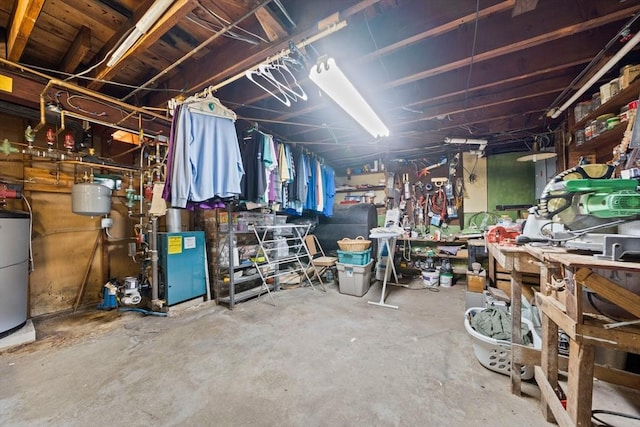 70 Bestick Rd, Braintree, MA 02184 - unfinished basement featuring a workshop area, water heater, and a heating unit