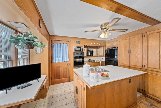 70 Bestick Rd, Braintree, MA 02184 - kitchen featuring black appliances, a sink, light countertops, a kitchen island with sink, and ceiling fan