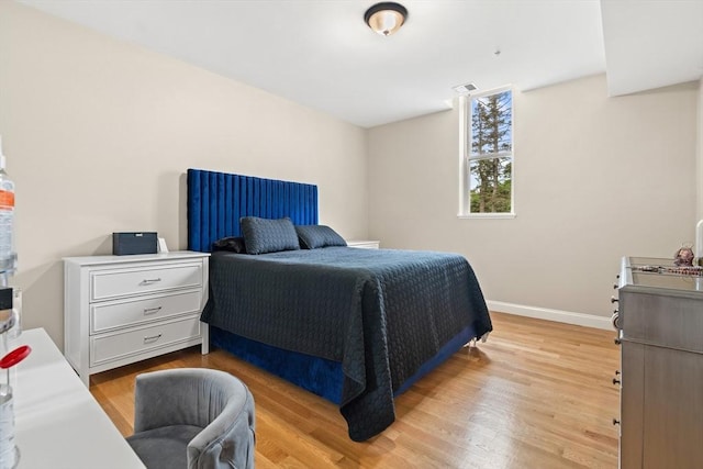 28 Broad St Unit 205, Marlborough, MA 01752 - bedroom featuring light wood-style flooring and baseboards