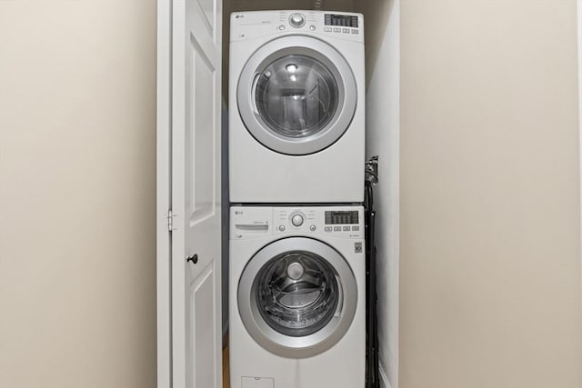 28 Broad St Unit 205, Marlborough, MA 01752 - laundry room featuring stacked washer / dryer