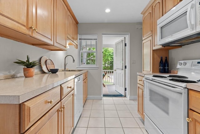 74 Boylston St Unit 2, Newton, MA 02467 - kitchen featuring white appliances, light countertops, a sink, light tile patterned floors, and baseboards