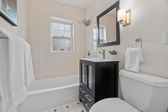 74 Boylston St Unit 2, Newton, MA 02467 - bathroom featuring toilet, vanity, tub / shower combination, and tile patterned floors