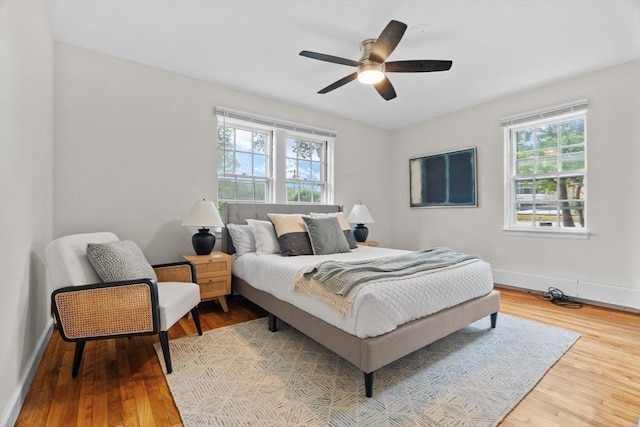 74 Boylston St Unit 2, Newton, MA 02467 - bedroom with wood finished floors, baseboards, and a ceiling fan