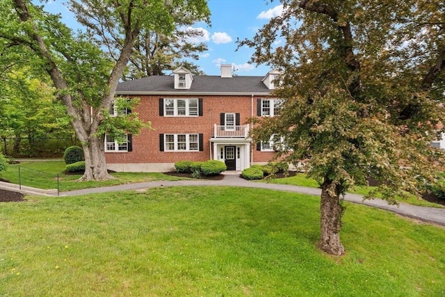 74 Boylston St Unit 2, Newton, MA 02467 - colonial home featuring brick siding, a balcony, and a chimney