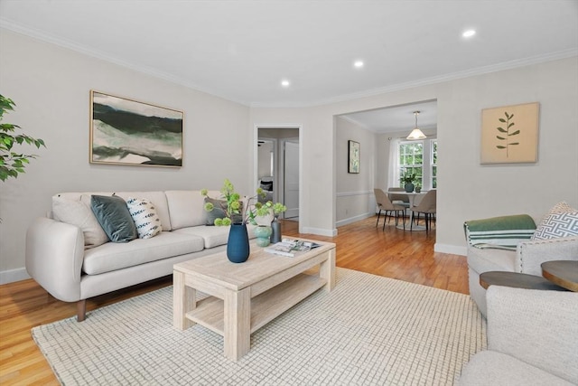 74 Boylston St Unit 2, Newton, MA 02467 - living room with light wood finished floors, ornamental molding, baseboards, and recessed lighting