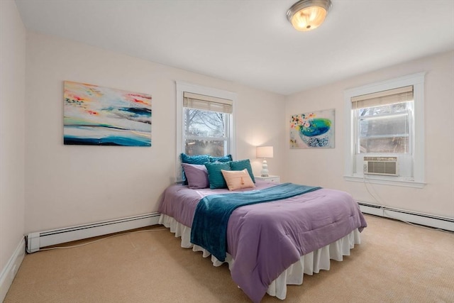 bedroom with a baseboard radiator, light colored carpet, and multiple windows