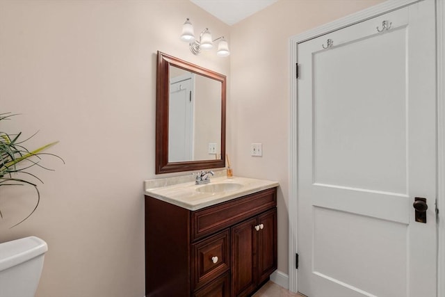 bathroom with toilet and vanity