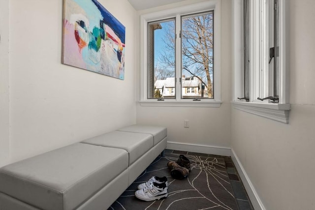 living area featuring baseboards