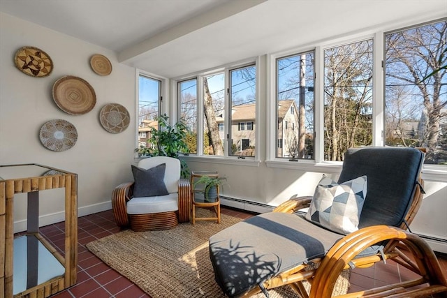 sunroom with a baseboard heating unit