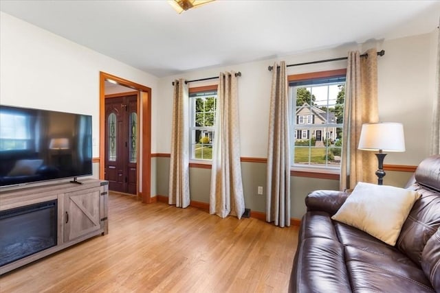 115 Winter St, Whitman, MA 02382 - living area with plenty of natural light and light wood-style flooring