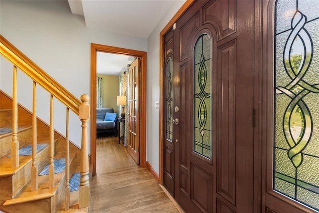 115 Winter St, Whitman, MA 02382 - entryway featuring light wood finished floors and stairway