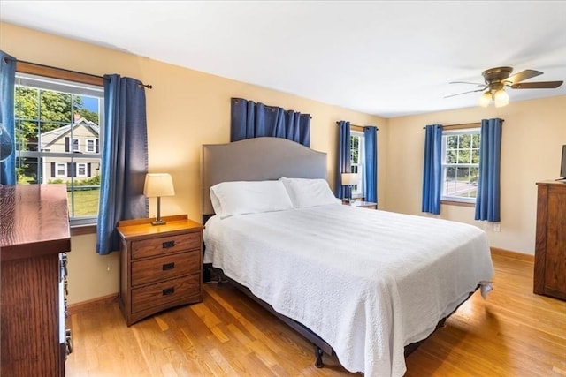 115 Winter St, Whitman, MA 02382 - bedroom with light wood-type flooring and a ceiling fan
