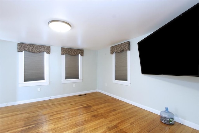 spare room featuring light hardwood / wood-style flooring