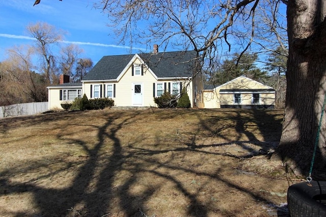 exterior space featuring a garage and a front yard