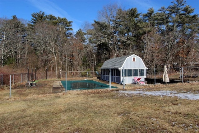 view of swimming pool with a lawn