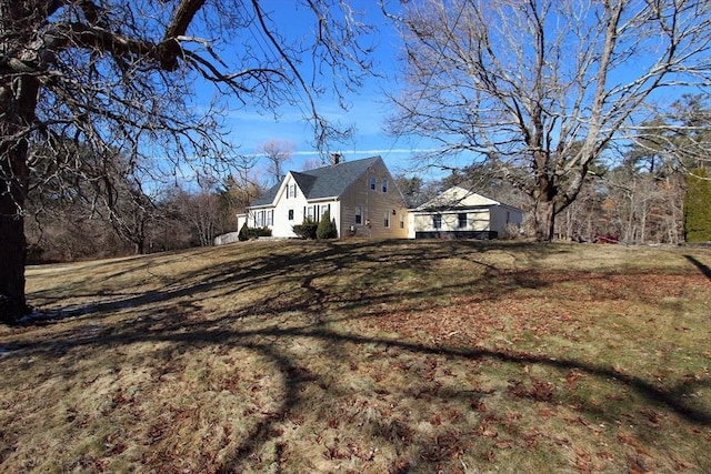 view of home's exterior with a yard