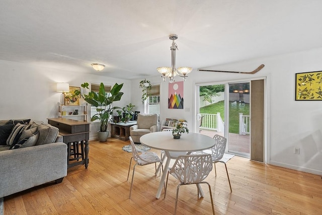 38 Phyllis Ln, Greenfield, MA 01301 - dining area with light wood-style floors, a chandelier, and baseboards