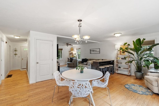 38 Phyllis Ln, Greenfield, MA 01301 - dining room featuring a chandelier, light wood-type flooring, and a ceiling fan