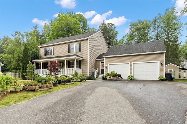 38 Phyllis Ln, Greenfield, MA 01301 - view of front of property with a garage, driveway, and covered porch