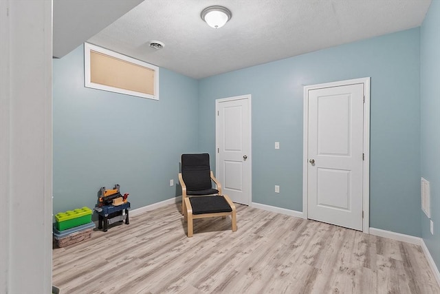 38 Phyllis Ln, Greenfield, MA 01301 - unfurnished room featuring wood finished floors, baseboards, and a textured ceiling