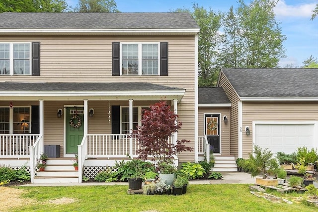 38 Phyllis Ln, Greenfield, MA 01301 - view of front of property featuring a porch, a garage, and a front lawn