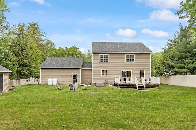 38 Phyllis Ln, Greenfield, MA 01301 - rear view of property with a wooden deck and an outdoor fire pit