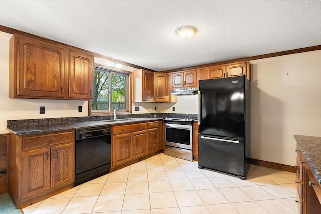 kitchen with black appliances, a sink, under cabinet range hood, brown cabinetry, and a textured ceiling