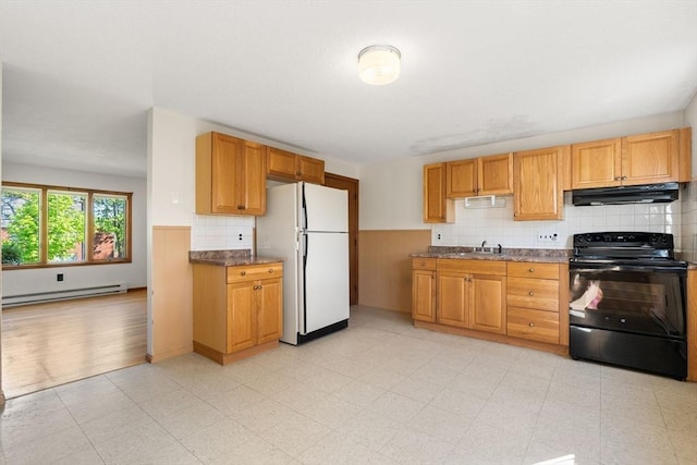 kitchen featuring electric range, freestanding refrigerator, baseboard heating, under cabinet range hood, and a sink