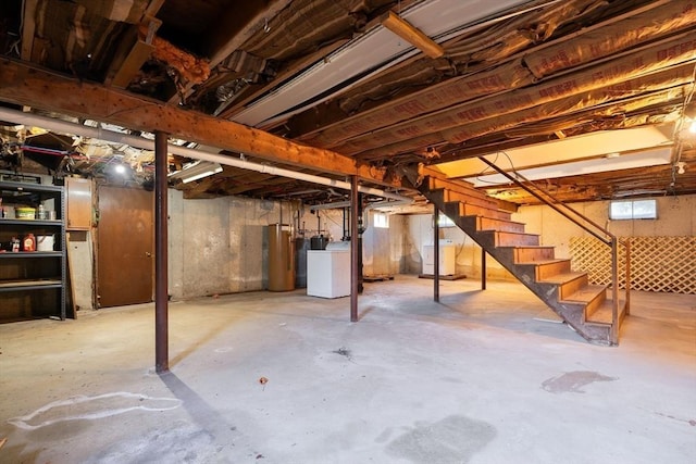 basement with stairway, washer / clothes dryer, and water heater