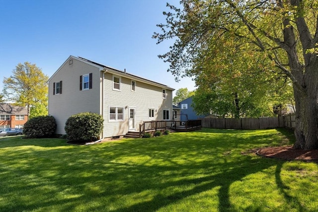 rear view of house featuring a wooden deck