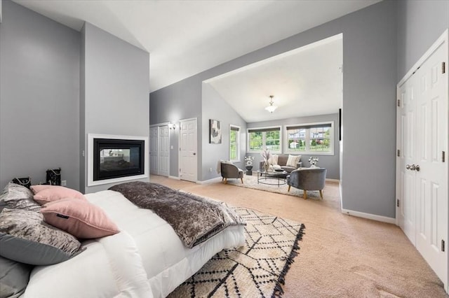 4 Patriots Blvd Unit 4, Hopkinton, MA 01748 - carpeted bedroom with lofted ceiling, baseboards, multiple closets, and a multi sided fireplace