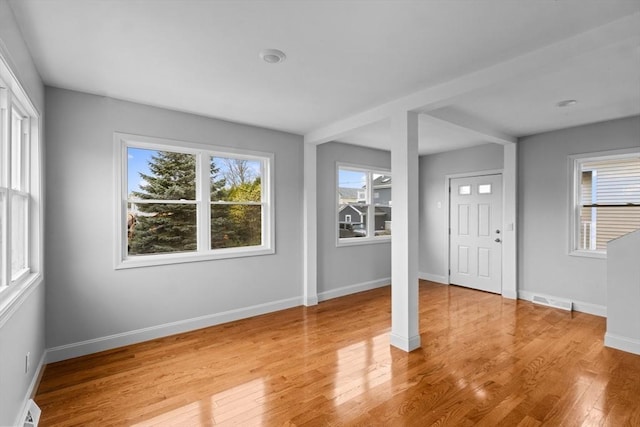 entrance foyer with light wood-style flooring and baseboards