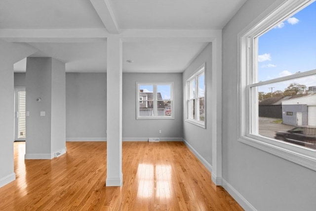 basement featuring light wood-style floors and baseboards