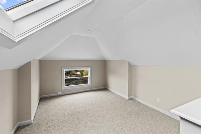 bonus room with carpet flooring, lofted ceiling, and baseboards