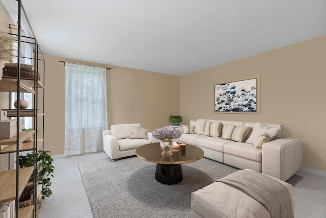 carpeted living room featuring baseboards