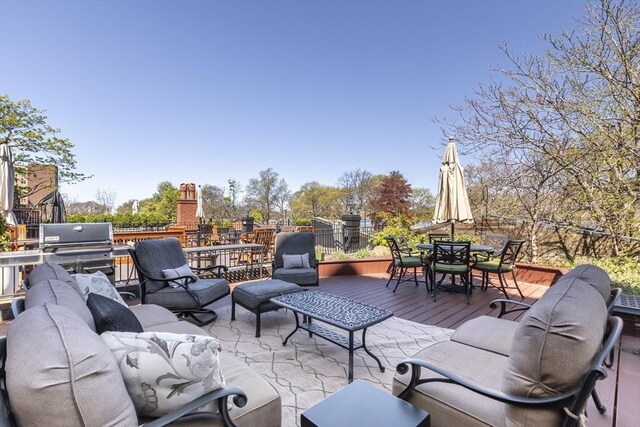 view of patio / terrace with outdoor dining space, a grill, a deck, and an outdoor living space
