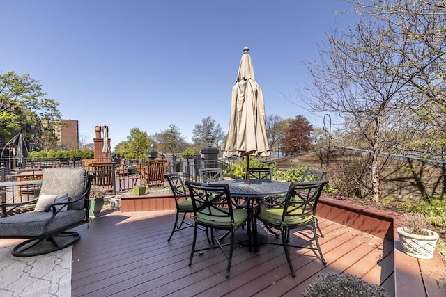 wooden deck with outdoor dining area