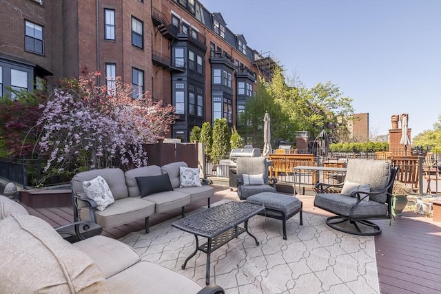wooden terrace featuring outdoor lounge area