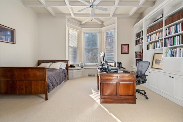 office area featuring coffered ceiling, beam ceiling, light carpet, and a ceiling fan