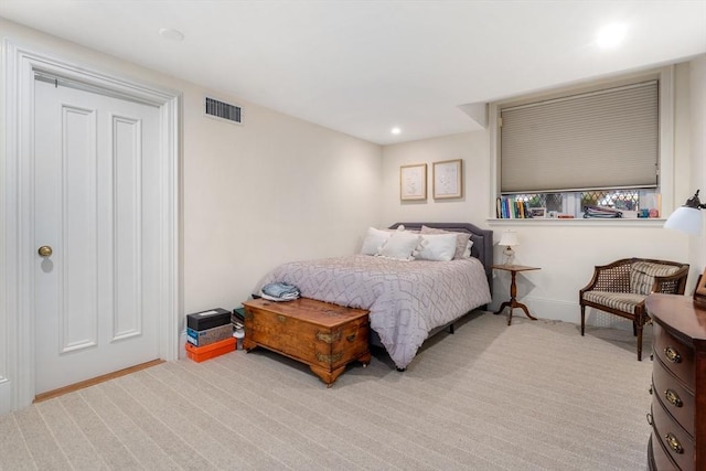 carpeted bedroom featuring baseboards, visible vents, and recessed lighting