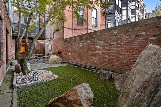 view of yard with a patio and fence