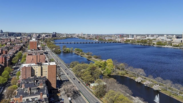 birds eye view of property featuring a water view and a view of city