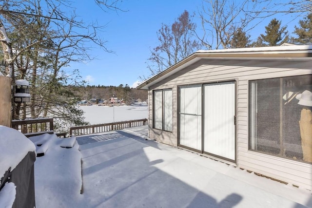 snow covered patio with grilling area