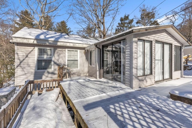 view of snow covered deck